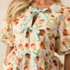 Beyond Compare Ecru Floral Cotton Bow Front Peplum Top