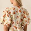 Beyond Compare Ecru Floral Cotton Bow Front Peplum Top